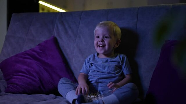 home, laughing, beautiful, people, family, couch, sitting, childhood, having fun, together, boy, caucasian, child, mother, togetherness, kid, tv, watching, fun, little, parenting, television, son, ado