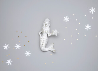 abstract winter sea background with mermaid and snowflakes
