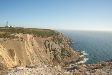  Espichel's cape on portuguese coast. A beautiful landscape of Portugal. Blue sky and big cliff