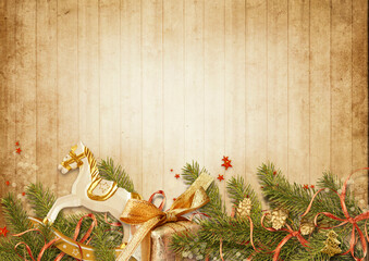 Christmas background. Christmas vintage card with holiday garland, gift and rocking horse on wooden...