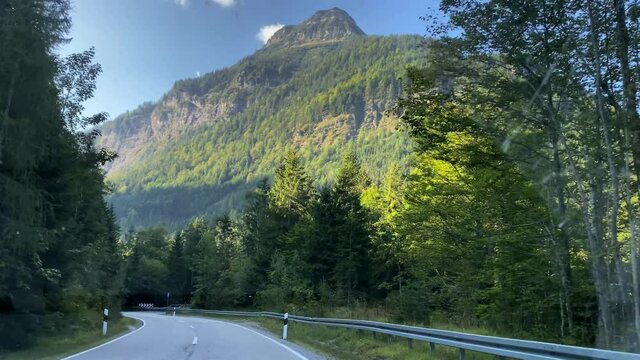 Karwendel mountains in Tirol. Austria. 4K.Shooting through not quite clean car glass