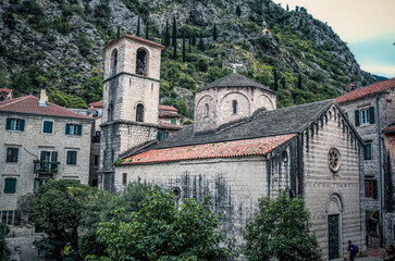 Famous old Christian church and tower in the city of Kotor. Montenegro, Balkans. Mountains. 