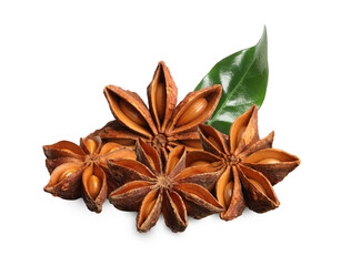 Aromatic dry anise stars and green leaves on white background