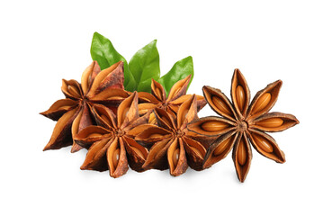 Aromatic dry anise stars and green leaves on white background