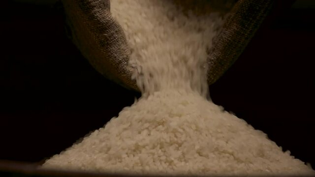 rice falling from bag white groats closeup