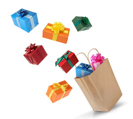 Many different gift boxes falling into paper shopping bag on white background