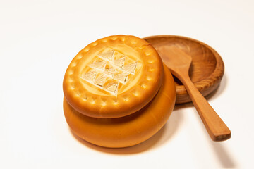 Prosphora and in a bowl made of wood and a wooden spoon, Prosvir, liturgical church bread, used during Orthodox services in the Orthodox Church. The concept of Orthodoxy.