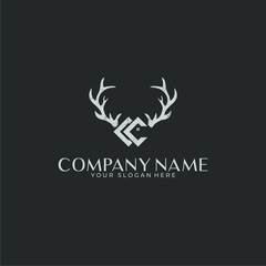 Logo negative space deer antlers with a house in a rustic style and CC monogram
