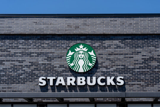 Whitchurch-Stouffville, On, Canada - May 30, 2021: Close-up of Starbucks coffee logo on the building. Starbucks Corporation is an American coffee company and coffeehouse chain.