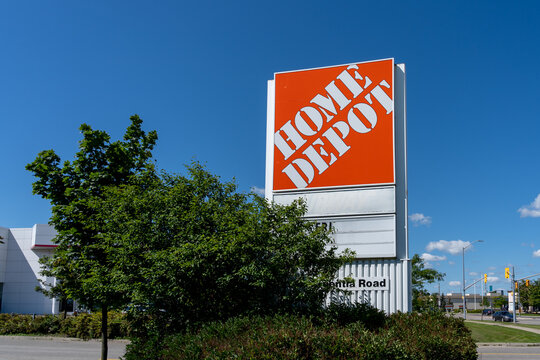 Mississauga, On, Canada - August 2, 2021: Close up of  Home Depot store sign with blue sky in background in Mississauga, On, Canada. Home Depot is an American home improvement retailer. 