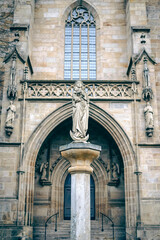 Sculpture of the virgin mary with child jesus in the courtyard of Erfurt Cathedral in germany