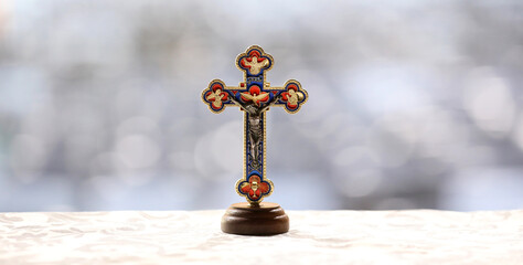 A beautiful light image of a detailed Christ on a Crucifix ornament. Located in the exact center of...