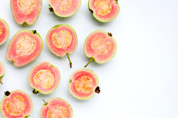 Fresh pink guava on white background.