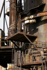 Mobile crane on the metal part of the building.