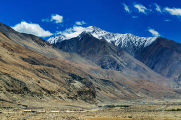 Fototapeta premium Scenic view of snow peaks, Leh ladakh landscape, light and shadow, Jammu and Kashmir, India