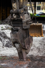 Metal hydraulic shears on a demolition excavator.