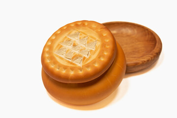 Prosphora for ordinances near a wooden bowl.