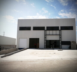 Crane and building construction site against blue sky