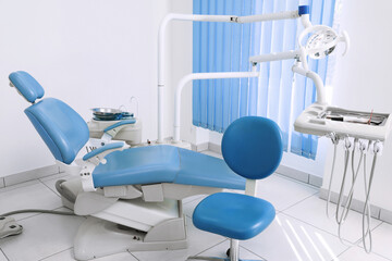 Dentist's office interior with chair and modern equipment