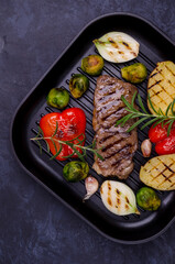 Fried beef steak with vegetables.
