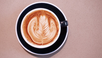 Latte art in coffee cup, Top view