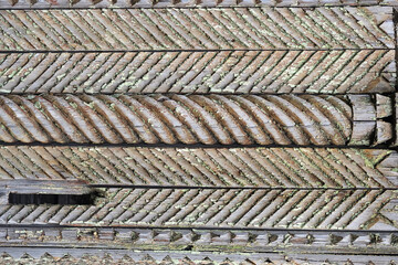 Old carved grunge stained wooden background 