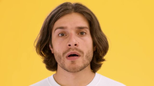 Thinking of idea. Close up portrait of young doubtful man pondering about problem solution and shaking head