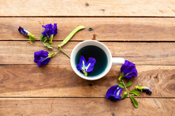 herbal drinks hot butterfly pea water for health care arrangement flat lay style on background wooden