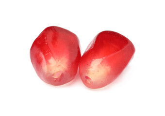 Juicy red pomegranate seeds on white background