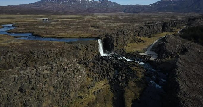 Oxararfoss Waterfall On A Sunny Day In Thingvellir National Park, Iceland. - aerial approach