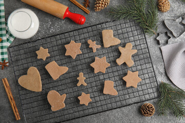 Homemade Christmas cookies. Flat lay composition with raw gingerbread biscuits on grey table