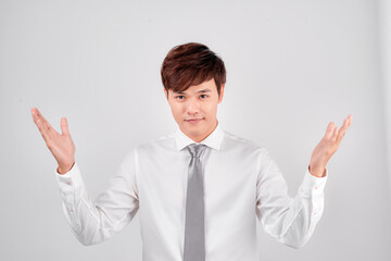 Excited surprised handsome young Asian man in casual white shirt doing open hand gesture - Powered by Adobe