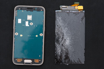 close-up of the replacement of the LCD screen on a smartphone, on a dark background