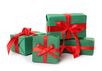 Green gift boxes with red bows on white background