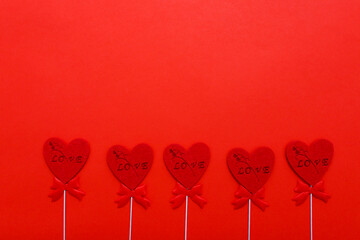 Red hearts on red background for valentines day. Holidays, love and romance