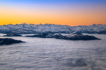 Fototapeta na wymiar Sunrise over the snow covered Alps