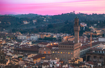 Pink sunsets over a tower in Tuscany 