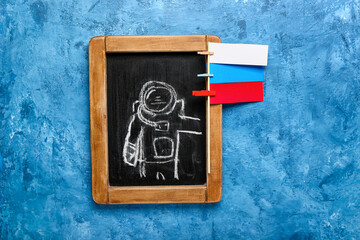 Russian flag concept. Drawn astronaut on blue background