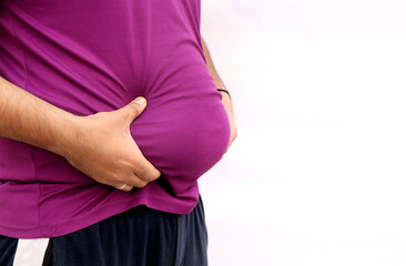 Portrait of a asian fat man show out his body and big belly.