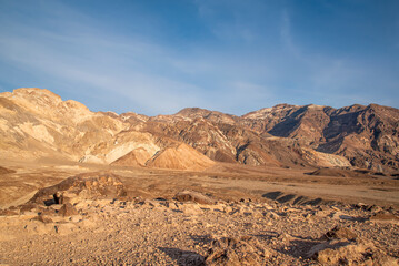 The multicoloured mounds of Artist's Drive in Death Valley National Park, California shimmer in the early evening sunset.