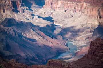 The mighty Colorado River cuts its way deeper as it winds its way through the Grand Canyon in Arizona.