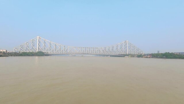 Howrah Bridge crowns the river. View from afternoon ferry ride. Kolkata West Bengal India