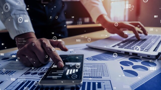 Businessman accountant or financial expert analyze business report graph and finance chart at corporate office. conceptual of finance economy, banking business and stock market research.