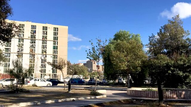 Time-lapse of people walking and cars in the Setif city.