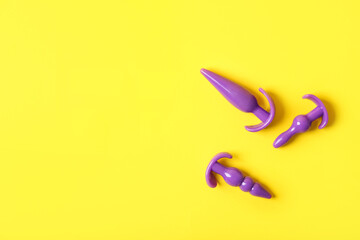 Anal plugs on color background