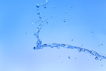 Splash of water on blue background