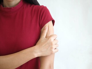 Woman with arm pain from muscle inflammation. health concept. closeup photo, blurred.