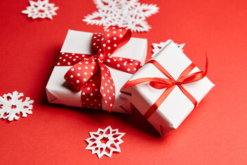 Christmas gift boxes with white snowflakes on red