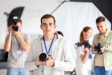 Fototapeta na wymiar Male photographer during classes in studio