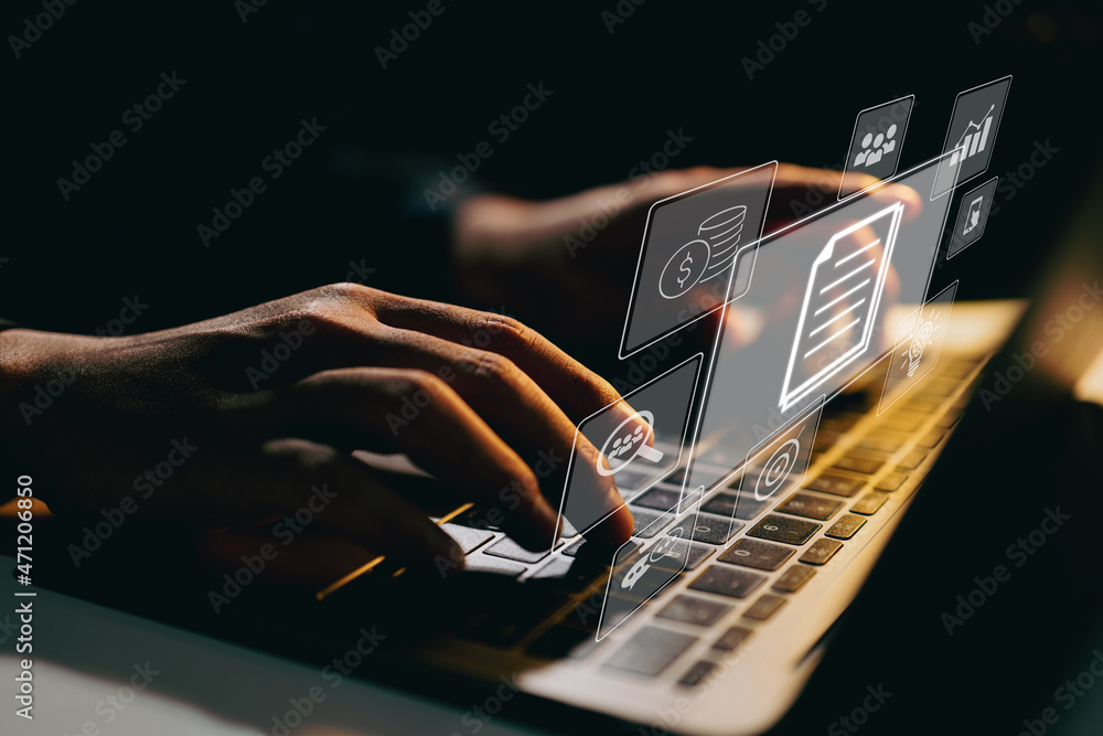 Aufkleber Businessman working on laptop computer with icons on virtual screen on office desk. Enterprise Resource Planning ERP, document management concept with icons on virtual screen.